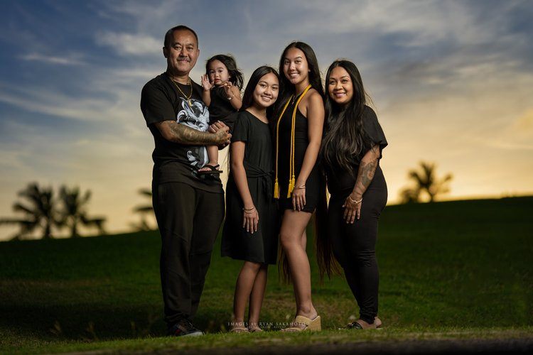 Family photographer. Oahu has sunsets for family portraits in Honolulu.