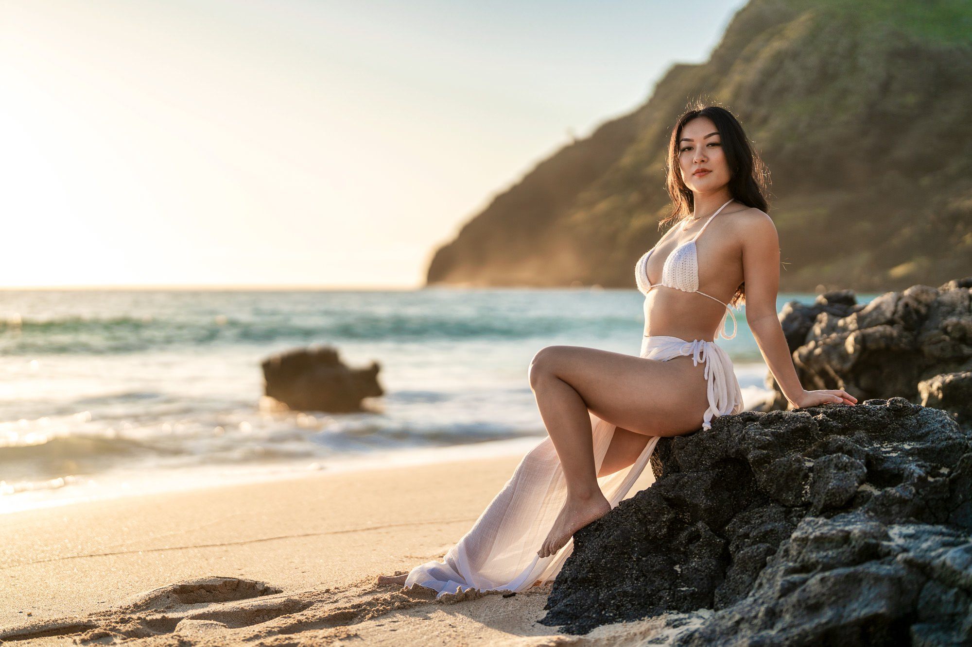 Early morning swimsuit photo shoot at sunrise at Makapu'u beach park. Early mornings are popular times for Oahu photographers. Warm colors give Honolulu photography a special look.