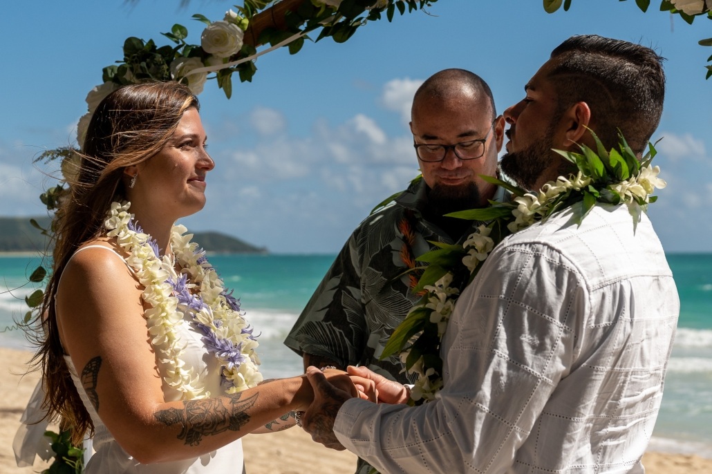 Honolulu elopement, photographer Ryan Sakamoto capturing Aubrey & Becca's wedding ceremony on the beach at Waimanalo Beach Park. 