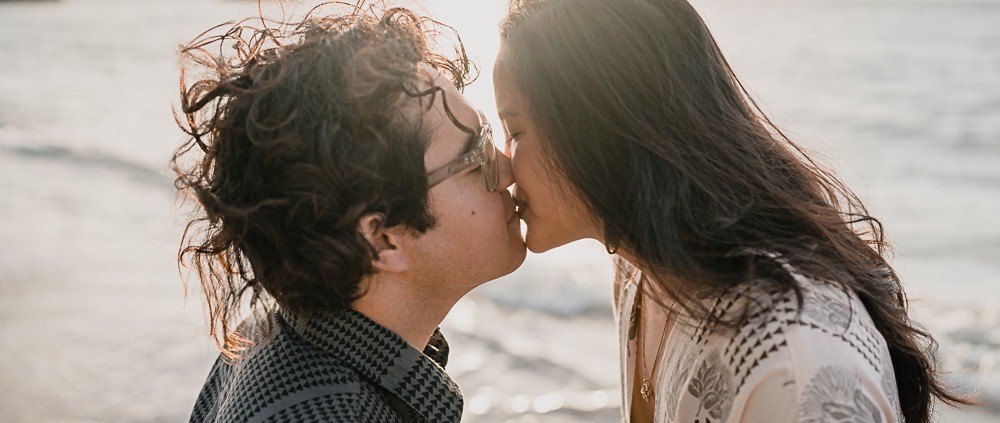 First kiss at sunrise, couples photo shoot behind the Kahala Regency.