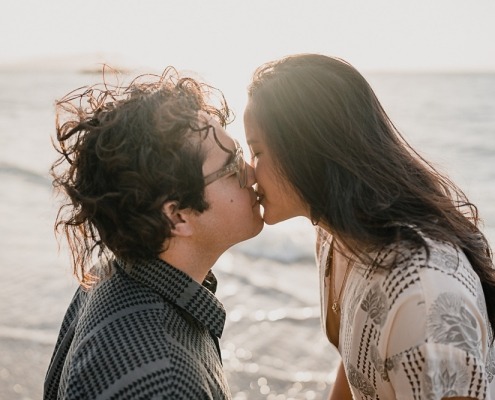 First kiss at sunrise, couples photo shoot behind the Kahala Regency.