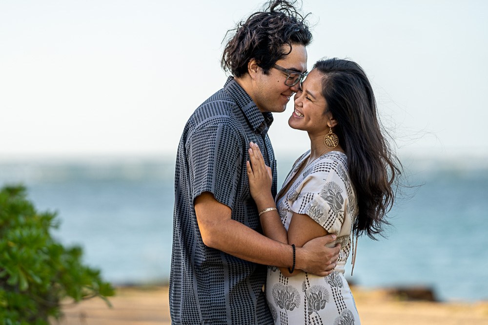 Emily & Koa, Oahu elopement photographer Ryan Sakamoto captures the couple at sunset.