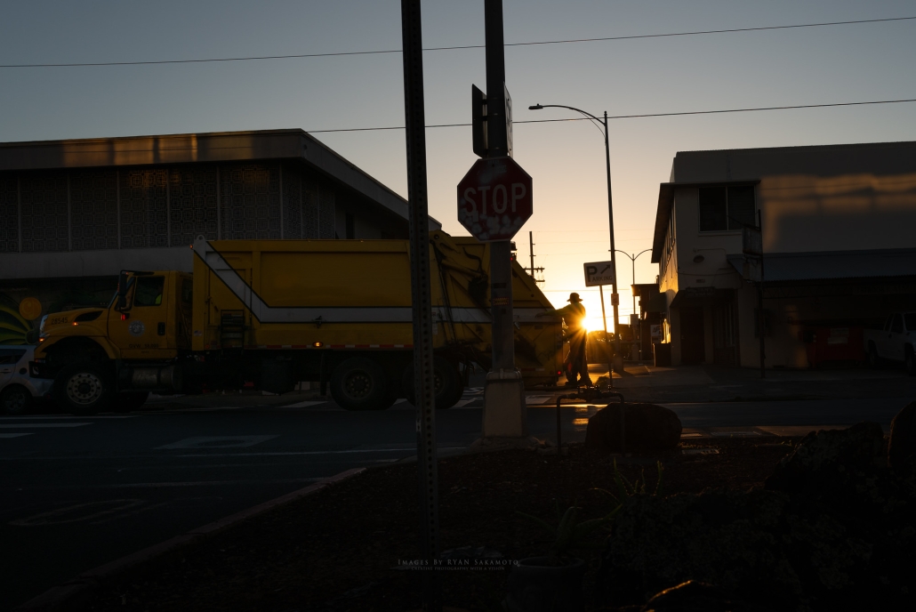 Honolulu hard working refuse workers in the early hours of the morning.